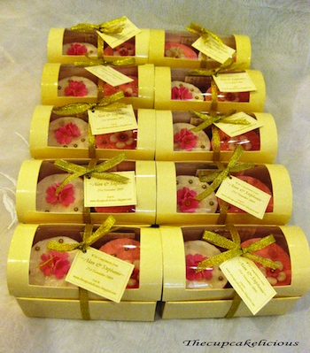 lavishly packaged in gold cupcake boxes with a personalized tag
